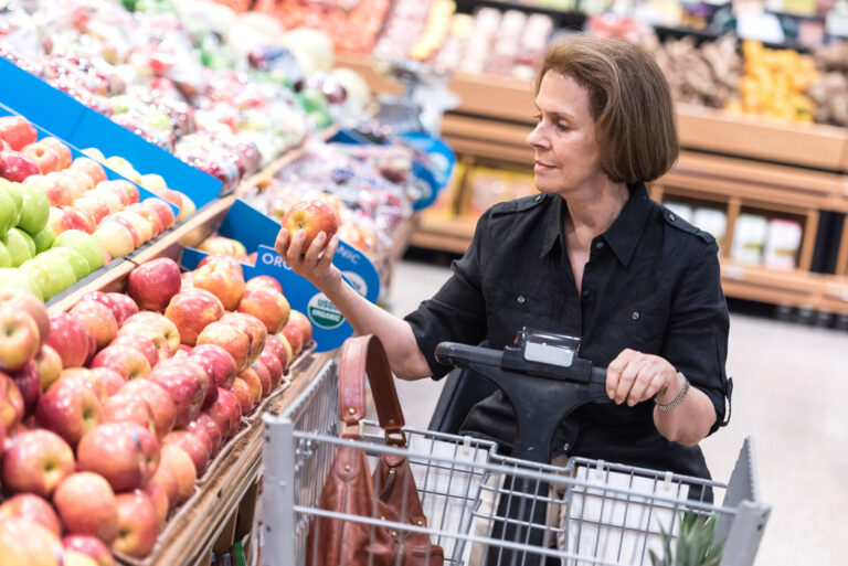 a person in a motorized scooter in a grocery store